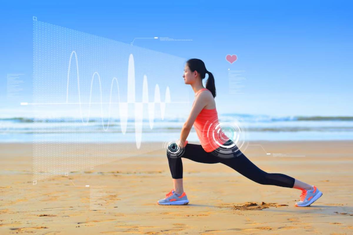 A person performs a lunging exercise on a beach, with digital health metrics projected around them against a clear blue sky.